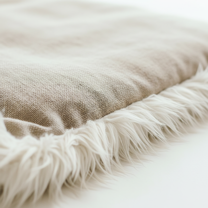 Macro close-up of natural linen fabric and white faux fur trim texture detail on pet mat