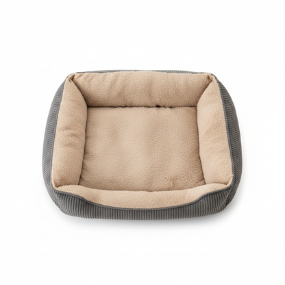Top-down bird's-eye view of large grey corduroy dog bolster bed with beige plush interior on white background